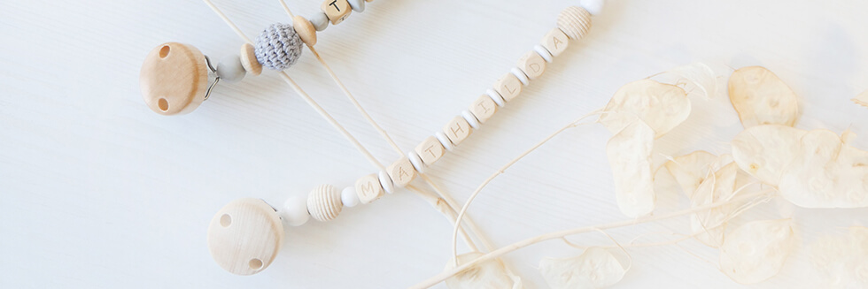 personalised dummy chains made from raw, untreated wooden beads