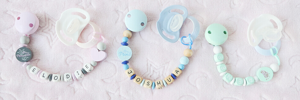 personalised dummy chains with names as a small, practical baby gift